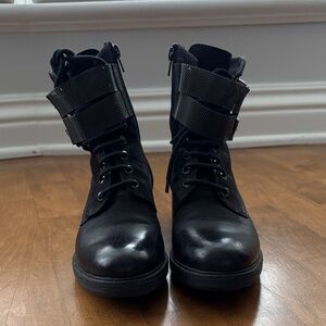 Black combat boots with silver hardware